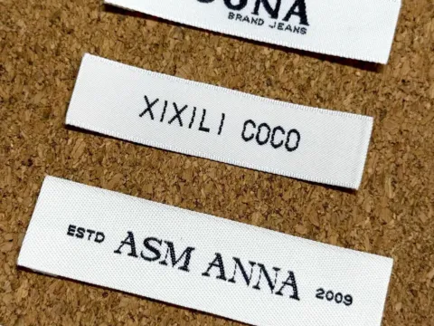 Side-by-side acid wash fabric swatches showing light, medium and heavy contrast grades