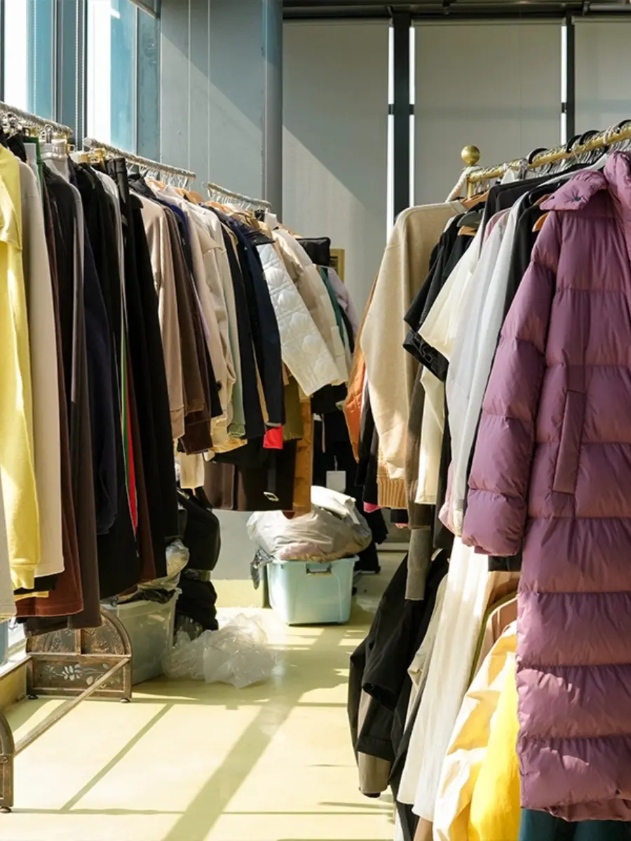 Acid wash hoodies on a finishing rack at a Dongguan garment factory