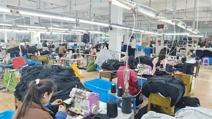 Sewing line running a bulk production order at the Dongguan factory
