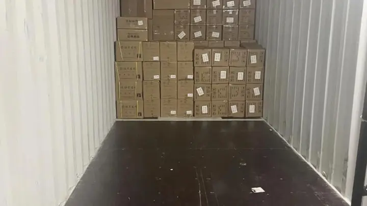 Shipping container being loaded for sea freight to Australia
