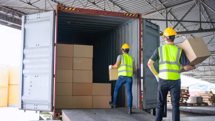 Shipping container being loaded for sea freight to Canada