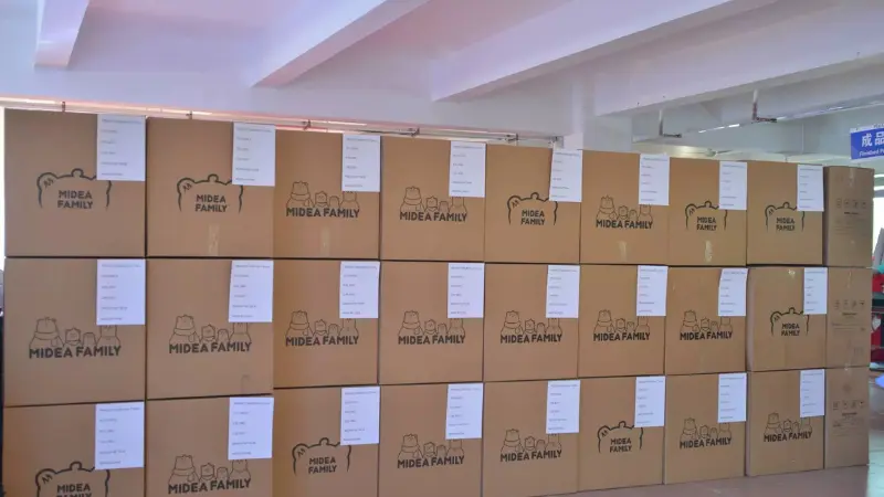 Export cartons sealed and labeled at the factory loading dock