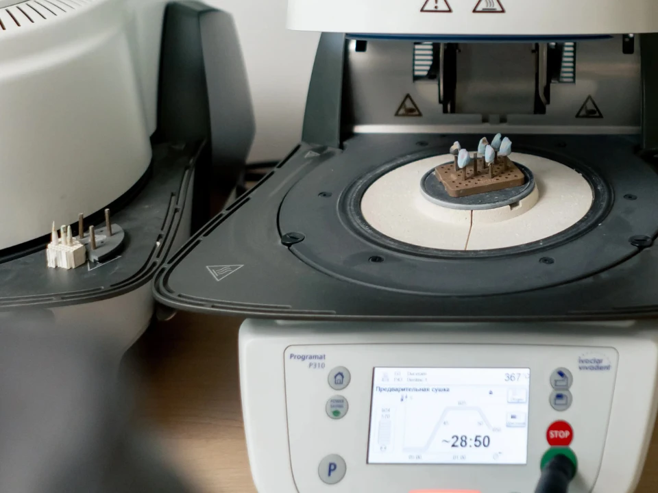 Quality control technician weighing a fabric swatch on a GSM scale