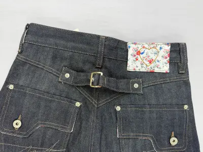 Hand-sanded whisker distressing on denim