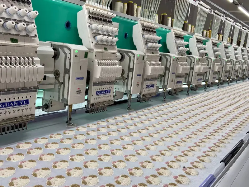 Multi-head embroidery machines running chainstitch designs