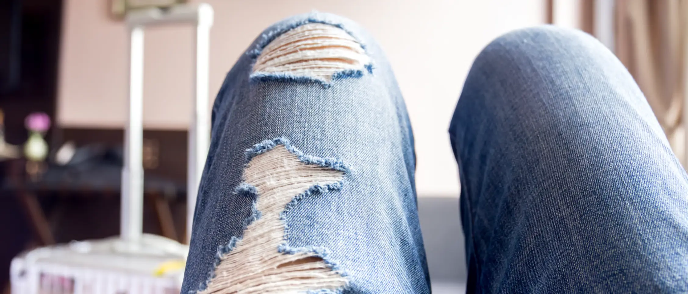 Worn raw denim jeans showing natural honeycomb and whisker fade patterns