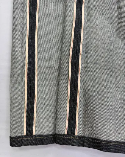 Raw selvedge denim jeans with red-line outseam detail