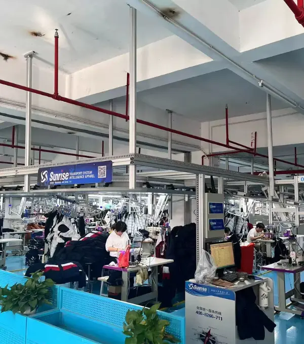 Sewing line producing streetwear t-shirts at a Humen, Dongguan garment factory