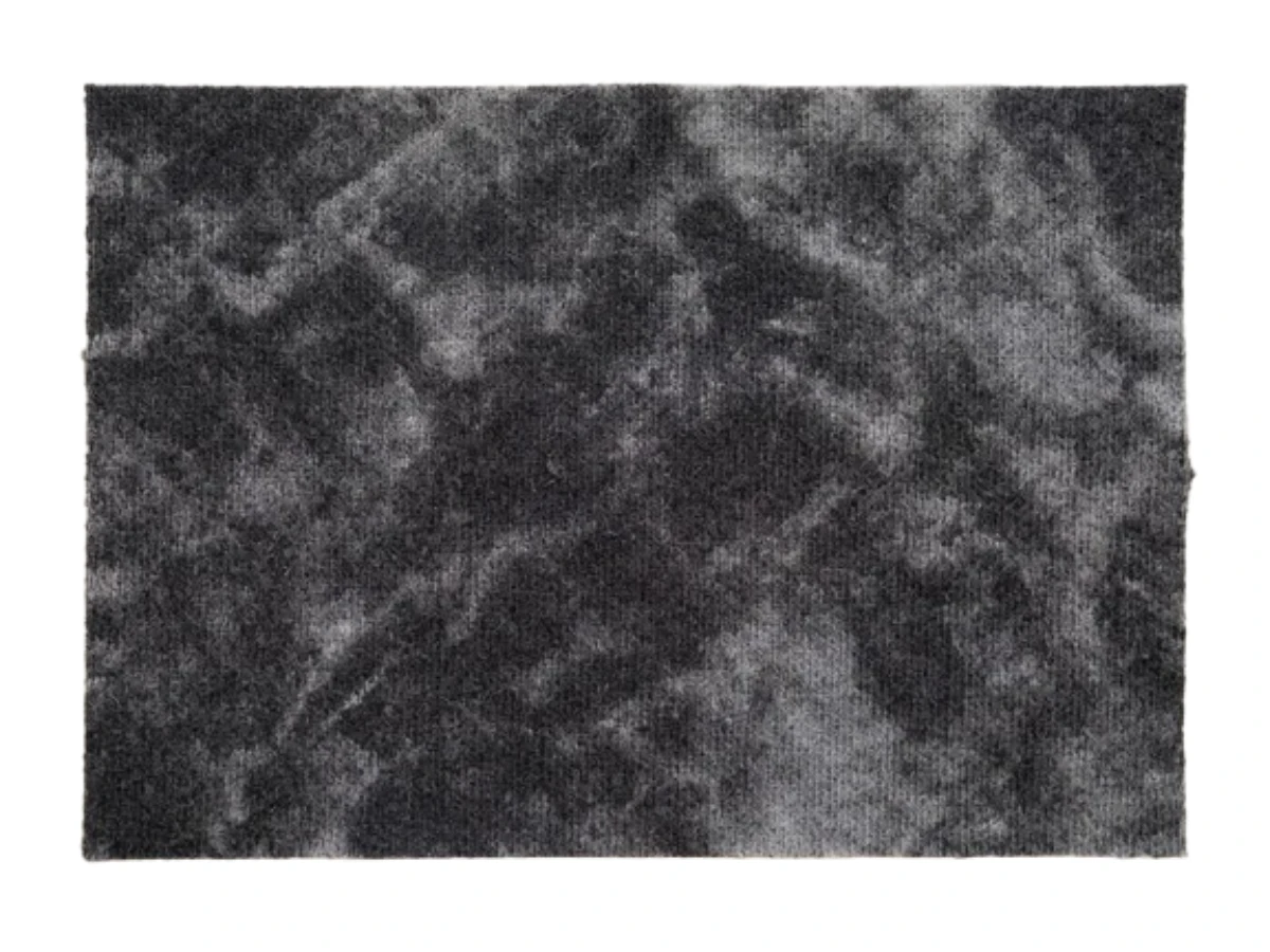 Washed-black fleece swatch with classic high-contrast acid wash marbling