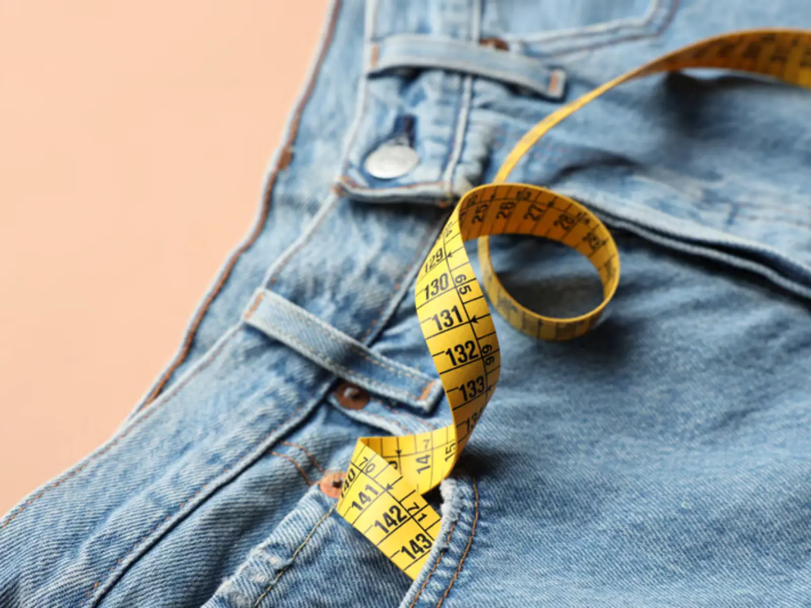 Jeans laid out for measurement and stitching inspection