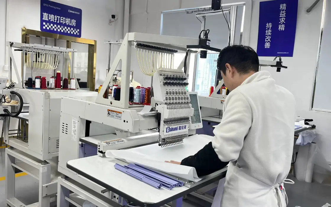 Multi-head embroidery machine stitching a custom streetwear logo