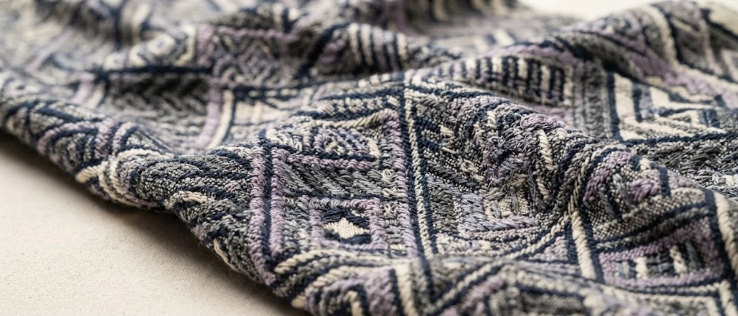 Close-up of custom jacquard fabric with a pattern formed by woven yarns