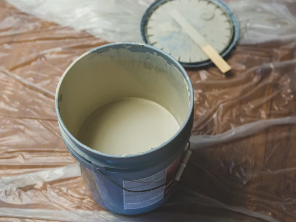 Puff-print ink being mixed with a spatula in a container