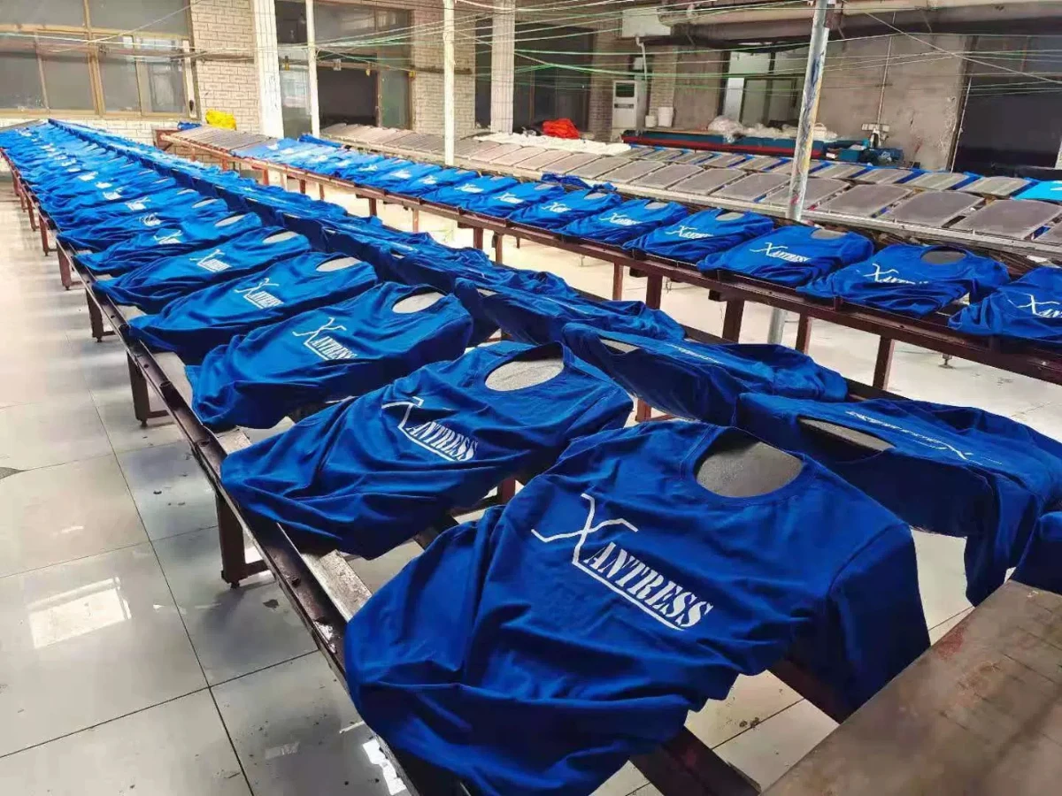 Printed cotton T-shirt on a conveyor dryer belt