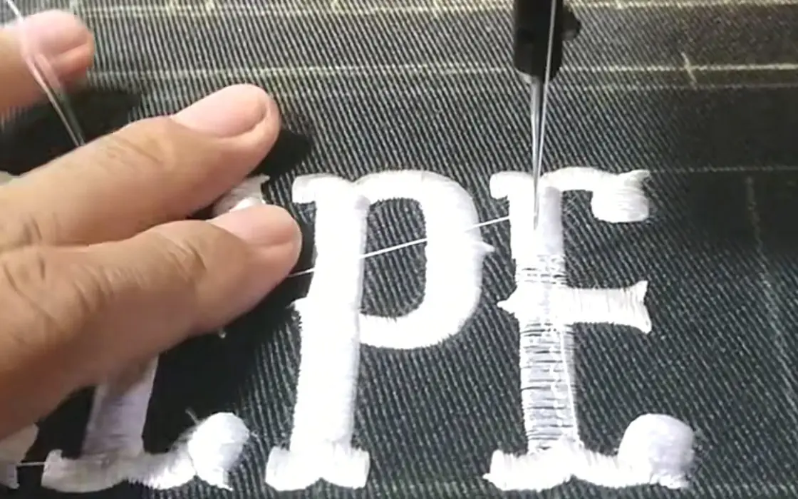 Raised puff print detail being checked on heavyweight hoodie fleece